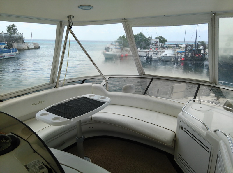 Sea Ray 55 luxury sport yacht moored at the Cozumel marina, ready for charters to Isla de la Pasion