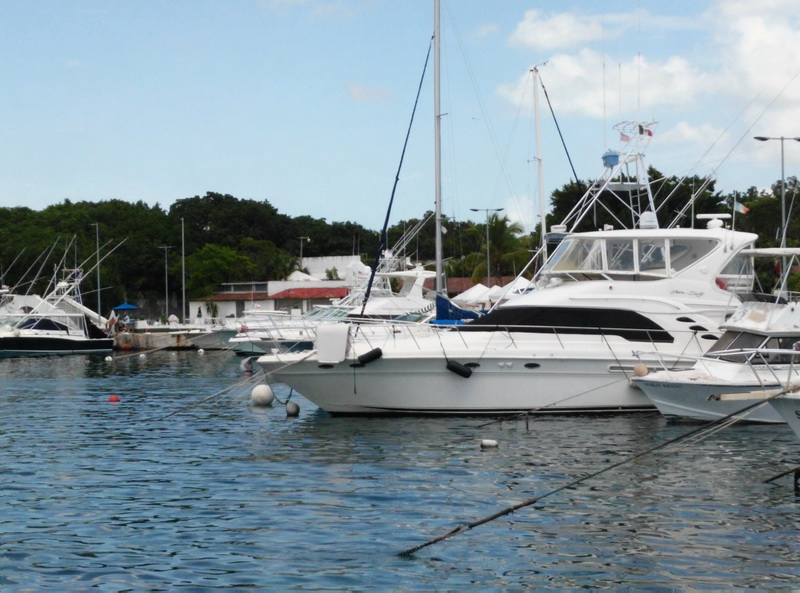 Sea Ray 55 sport yacht anchored in the turquoise Caribbean off Cozumel Island, the largest charter yacht for groups and families