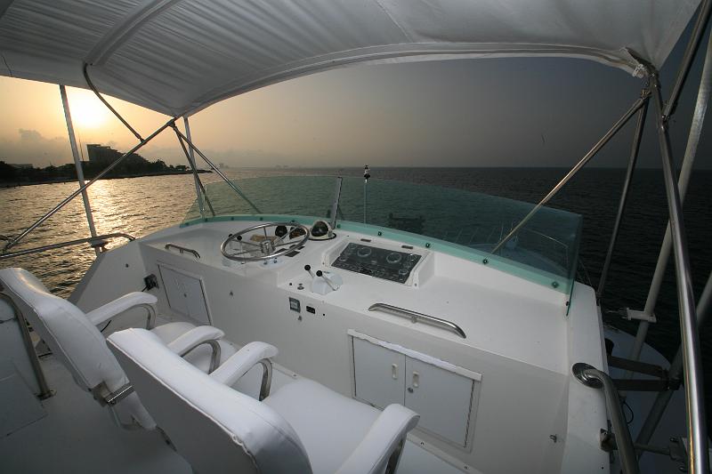 Bertram 58 ft flybridge yacht for weddings and overnight charters on the turquoise Cancun Caribbean