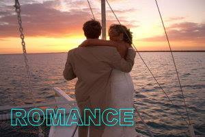 Romantic sunset dinner yacht cruise for two gliding across the calm turquoise Cancun Caribbean at golden hour