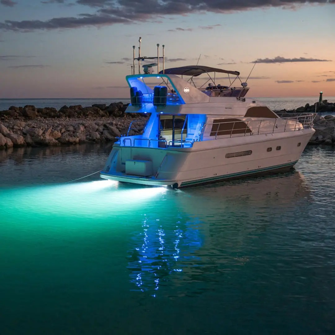White 60 ft Azimut luxury motor yacht with flybridge at Puerto Aventuras marina, Riviera Maya — private charter for up to 28 guests toward Tulum