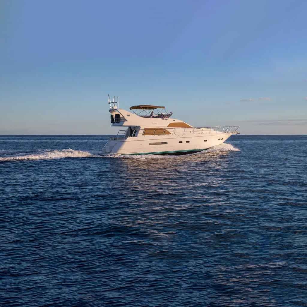 Azimut 60 air-conditioned salon interior with U-shaped leather seating for up to six guests