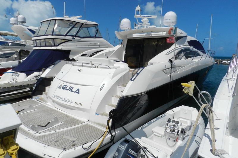 Swim platform and tender of the 72 ft Sunseeker Predator Aguila docked at the marina, luxury yacht charter Cancun